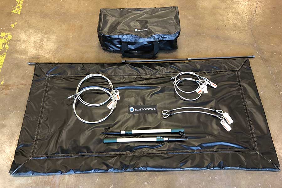 Blast Control Pressure Test Enclosure Kit And Bag Laid Out On Floor